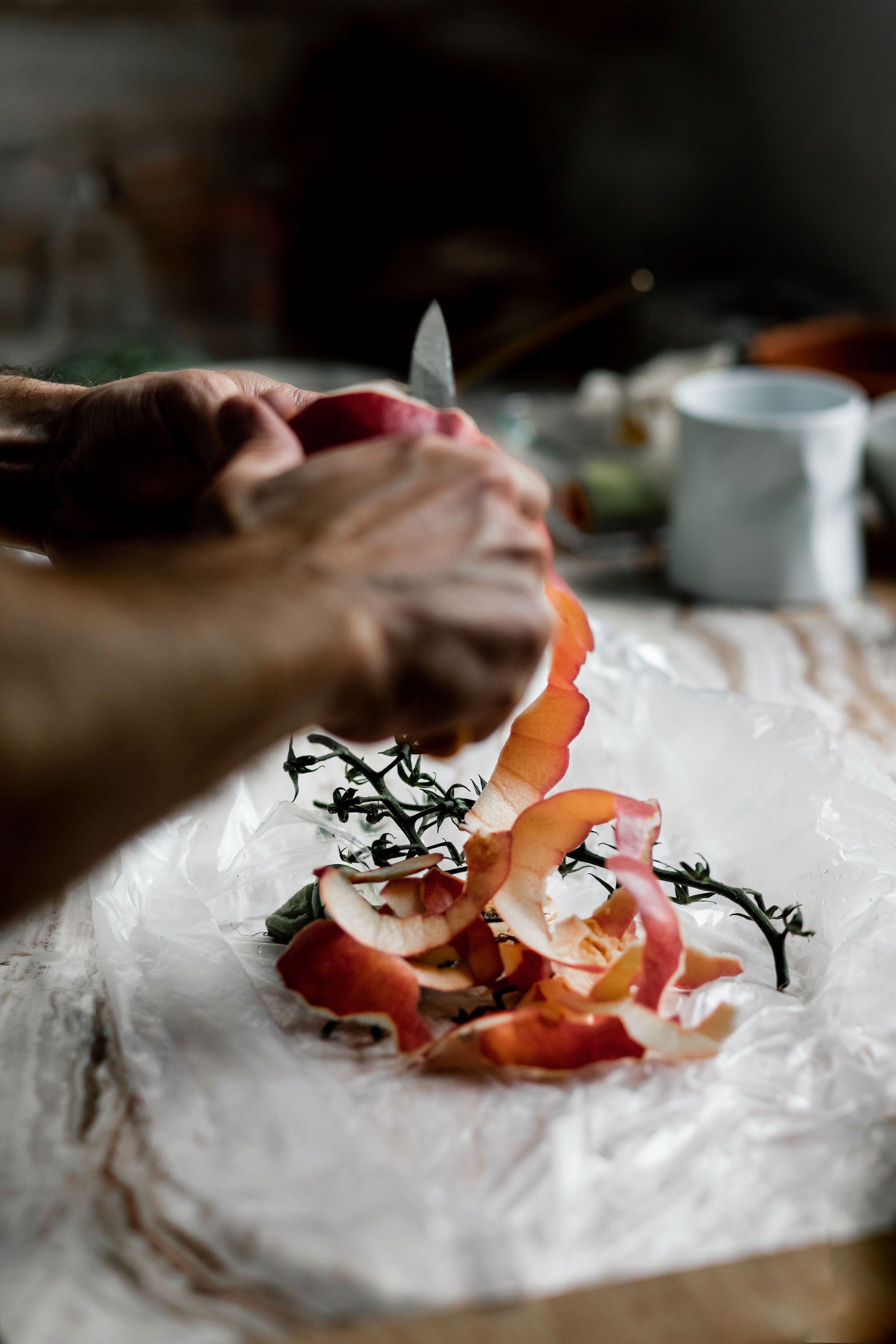 closeup of chef peeling an apple