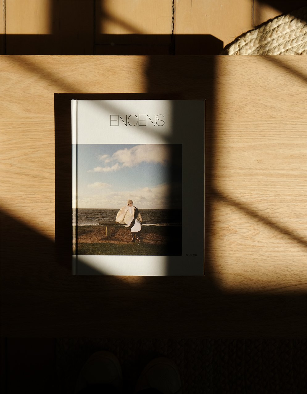 Encens book sitting on table in a sunbeam