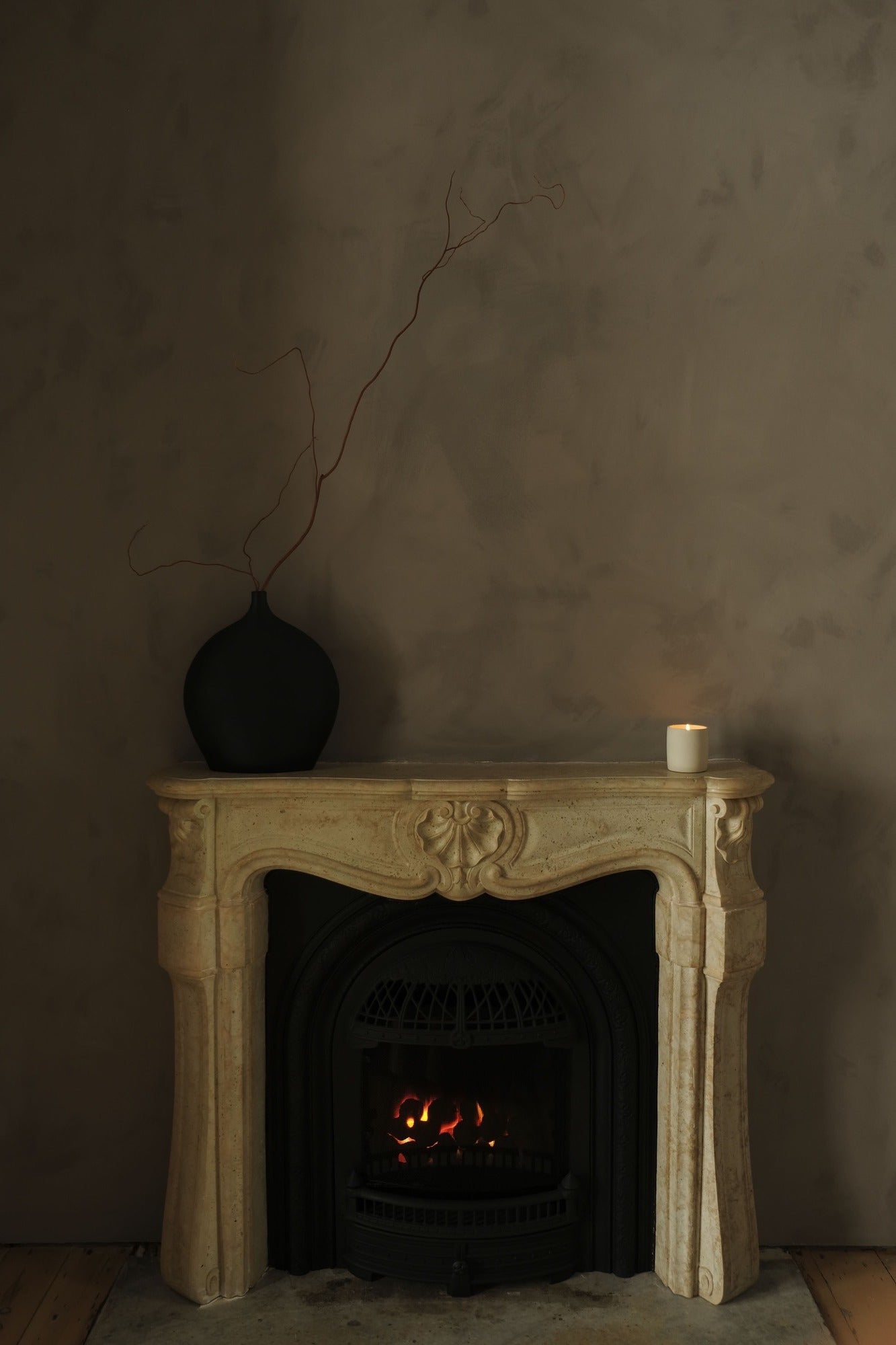 warm grey plaster walls and white marble fireplace