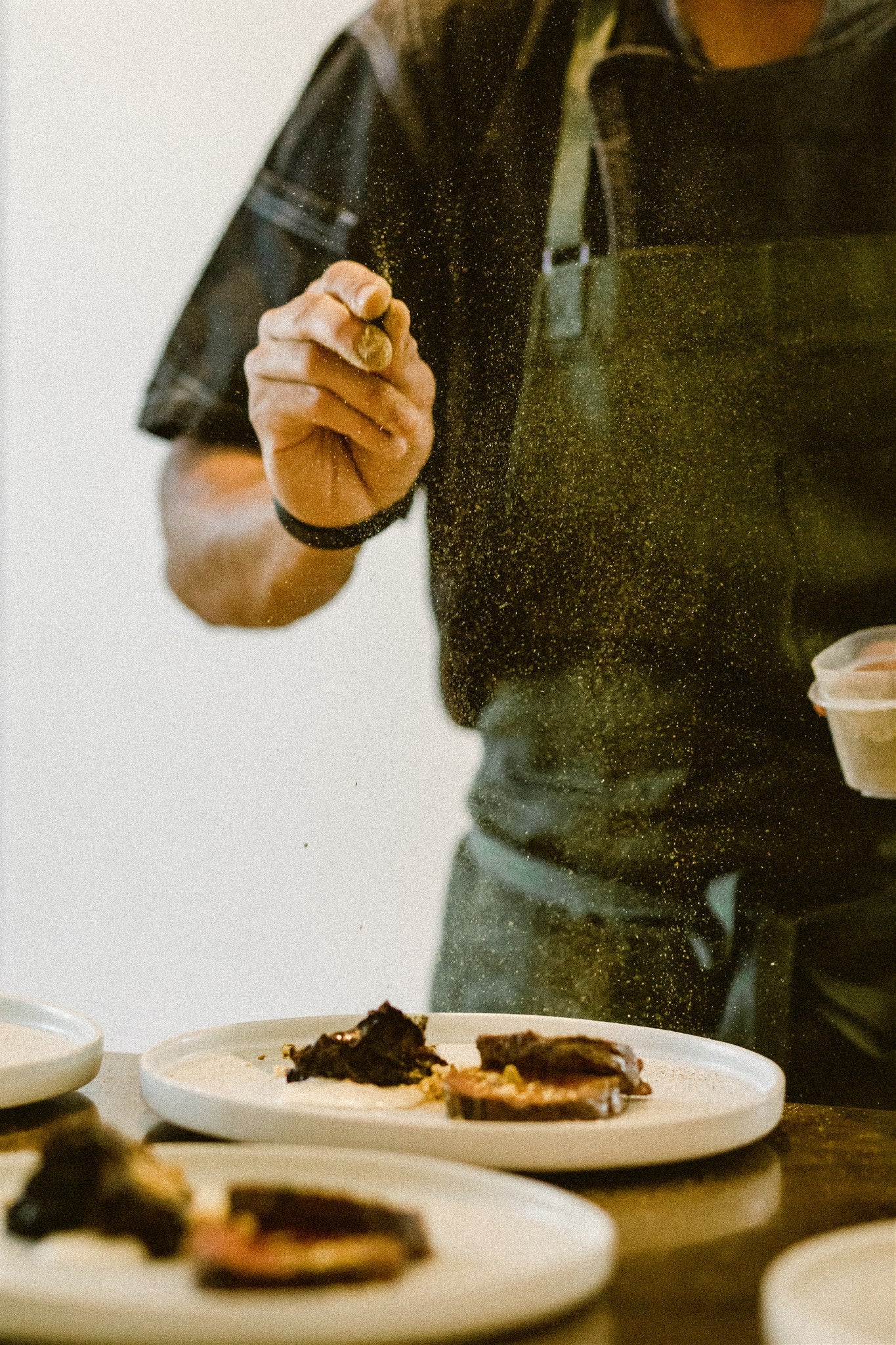 chef Aakash Dhall adds finishing touches to a dish