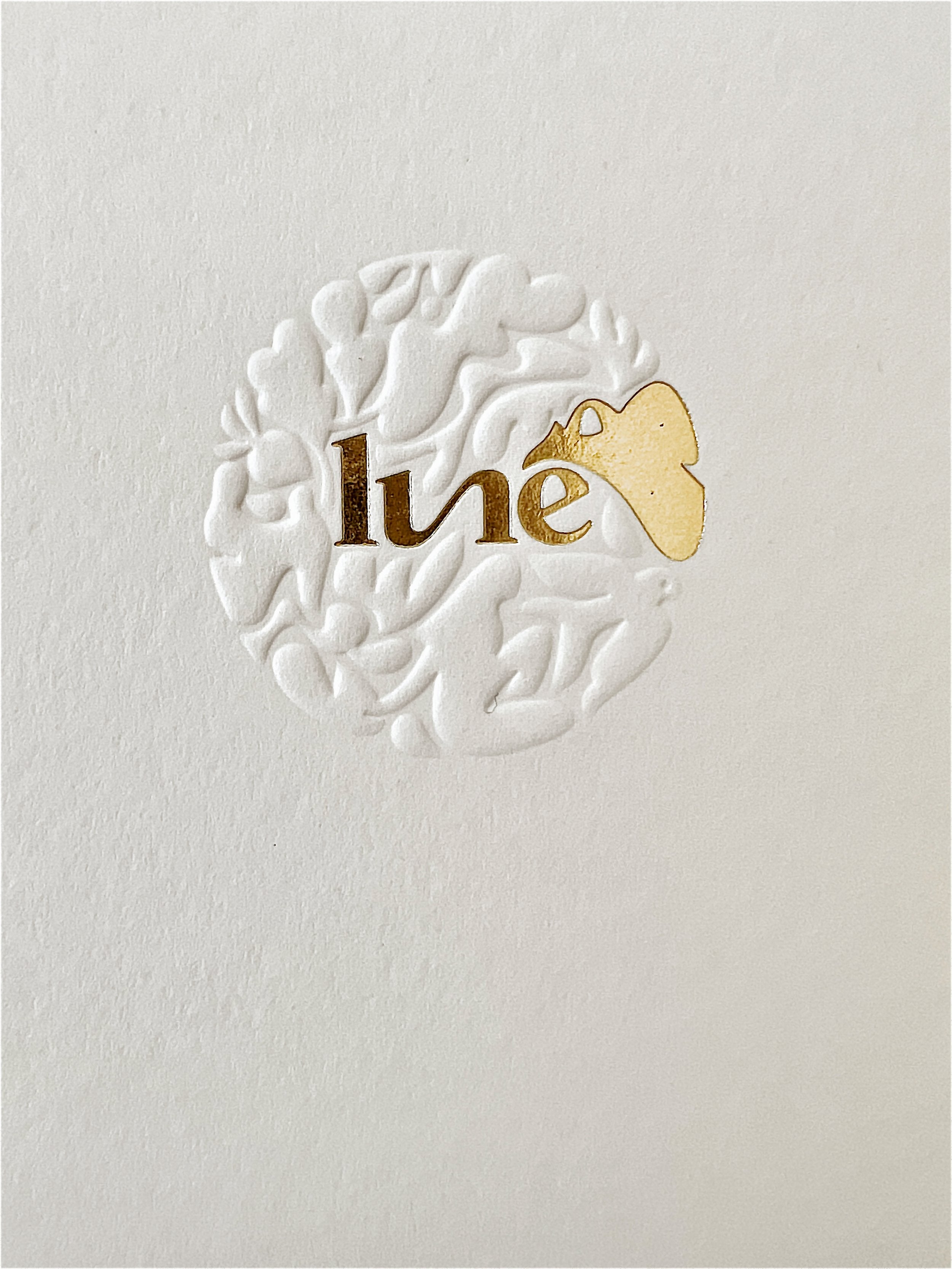 Lune logo embossed on paper