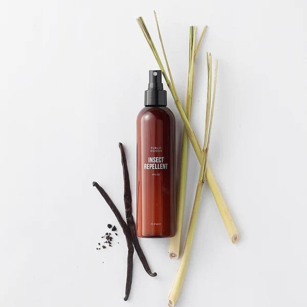 brown bottle of insect repellant, vanilla beans, lemongrass