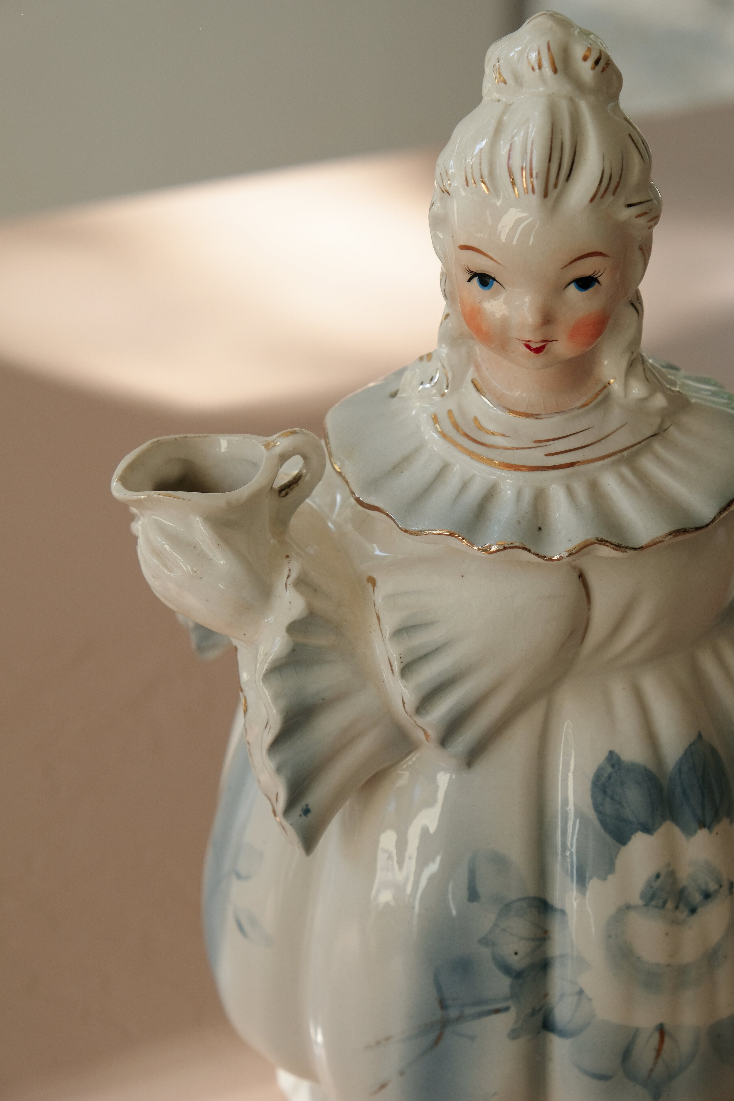 a teapot shaped like a woman