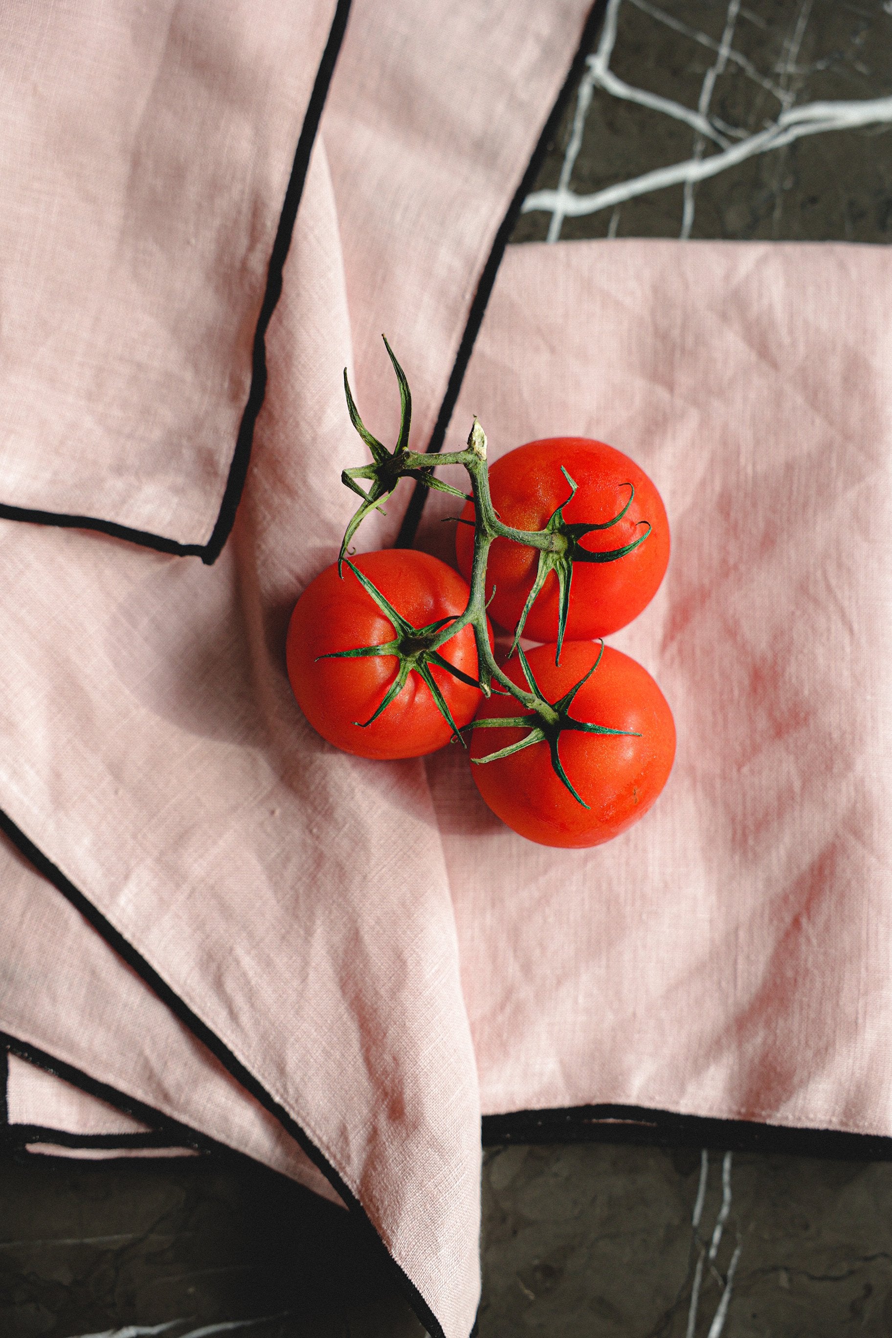 pink linen napkins with black edge detailing