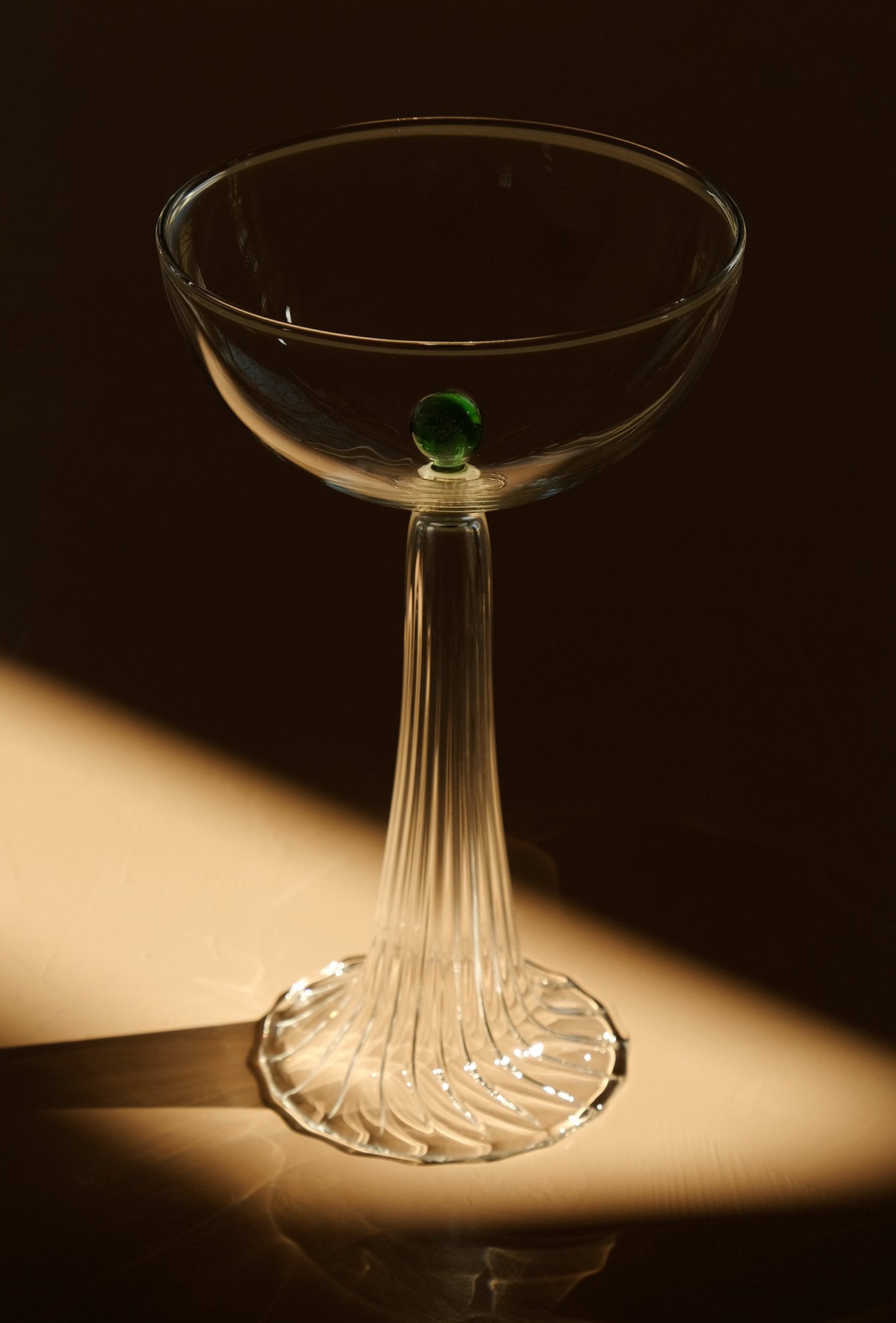 coupe glass with green glass detail