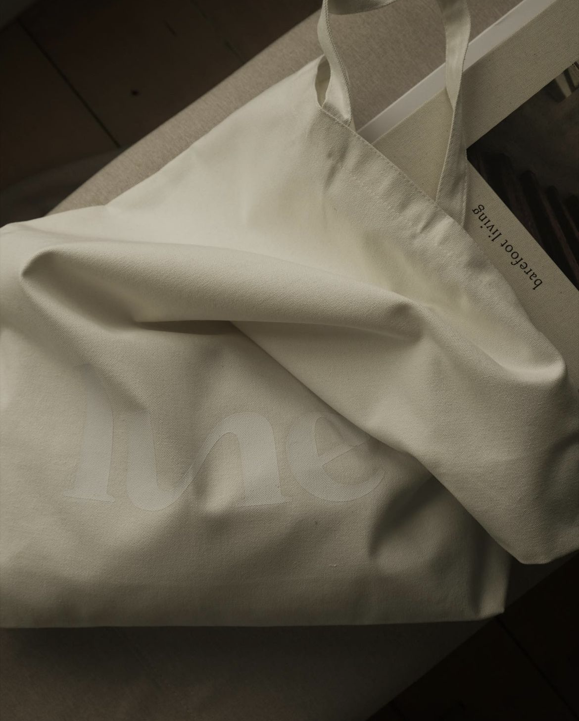 oversized tote bag with white Lune logo printed on it